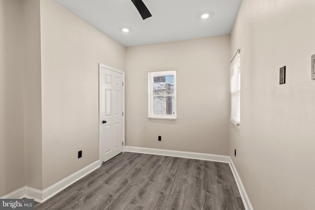 empty room with ceiling fan and wood-type flooring