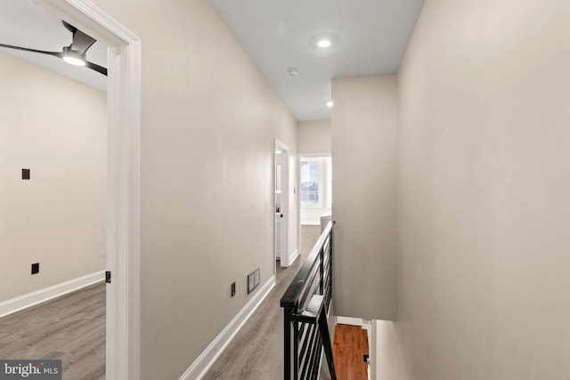 hallway with light hardwood / wood-style flooring