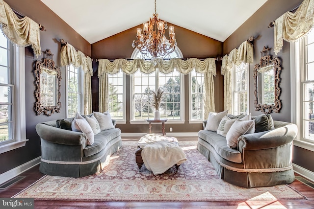 sitting room featuring a healthy amount of sunlight and vaulted ceiling