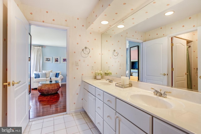 bathroom with hardwood / wood-style flooring and vanity