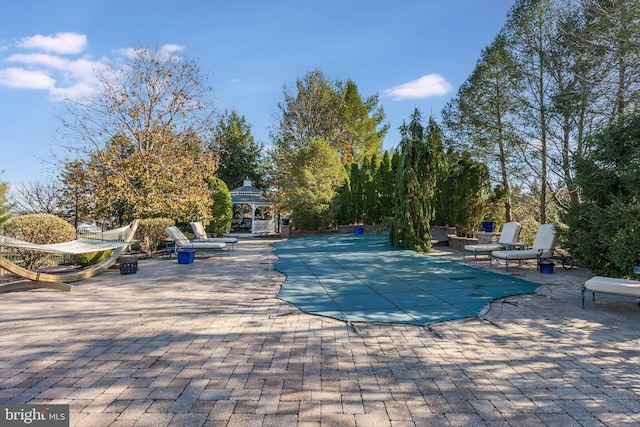 view of pool with a gazebo and a patio