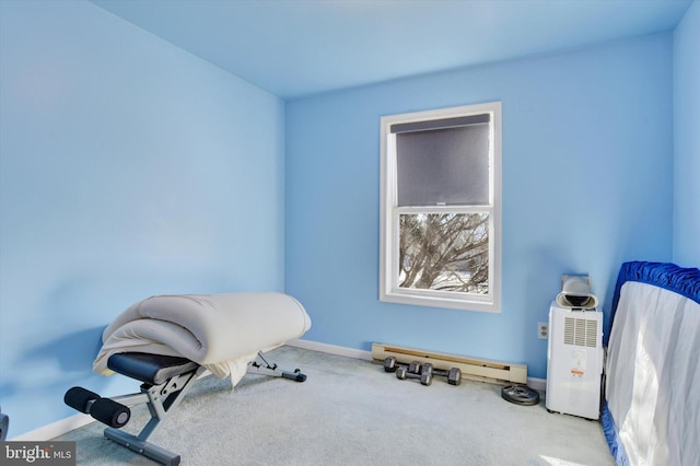 misc room featuring light carpet and a baseboard heating unit