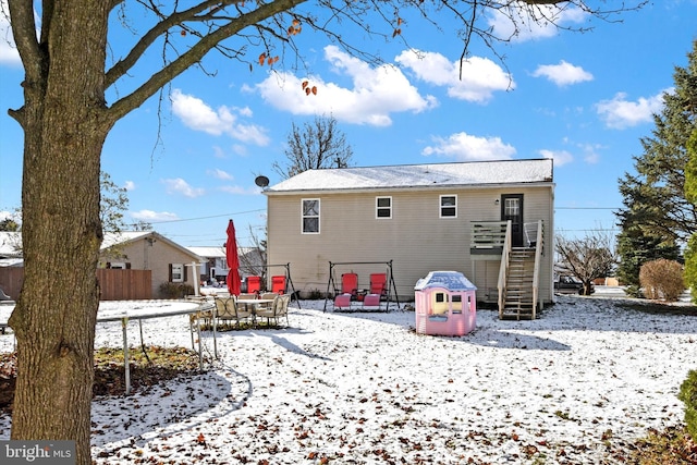 view of snow covered house