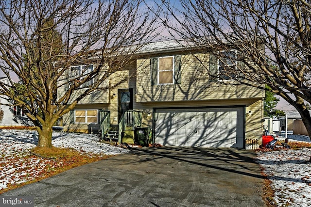 bi-level home featuring a garage