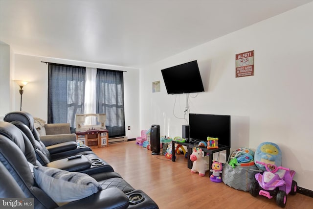 living room featuring hardwood / wood-style floors and a baseboard radiator