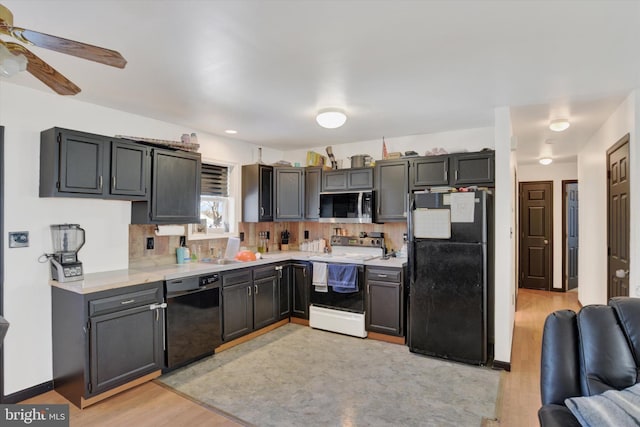 kitchen featuring ceiling fan, sink, light hardwood / wood-style flooring, decorative backsplash, and black appliances