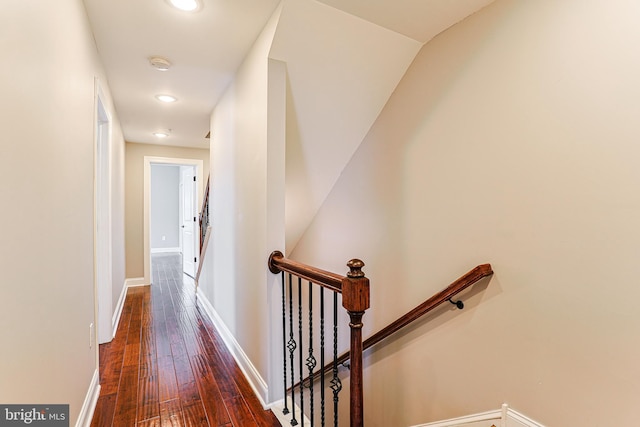 hall with dark wood-type flooring