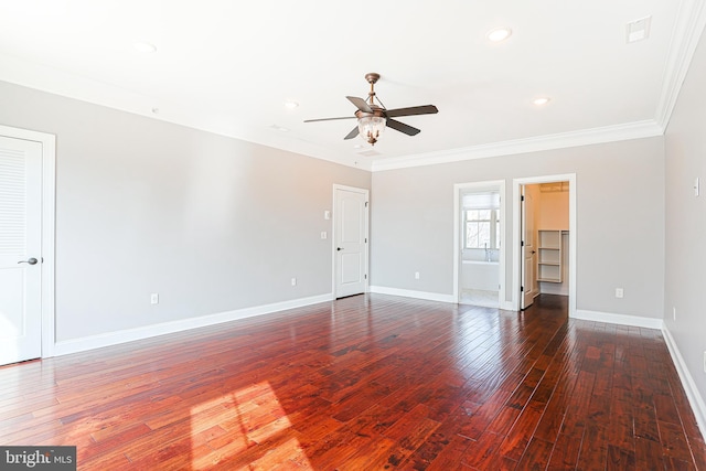 spare room featuring ornamental molding, dark wood-type flooring, and ceiling fan