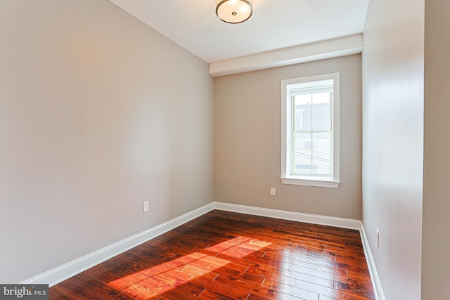 unfurnished room with dark hardwood / wood-style floors