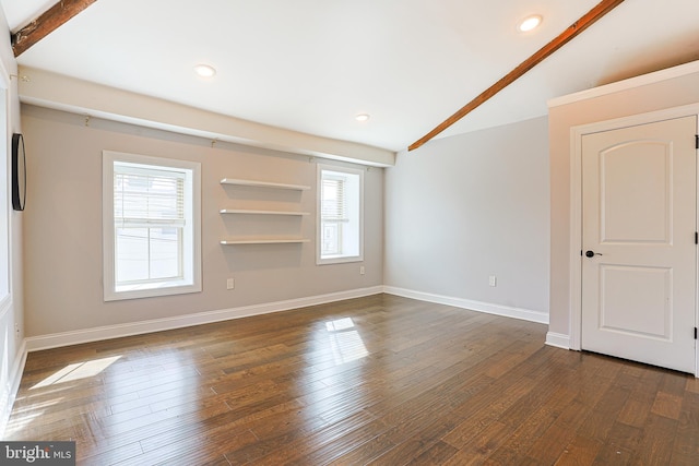 spare room with dark wood-type flooring