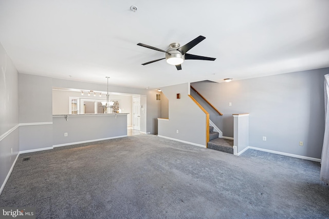 unfurnished living room featuring carpet and ceiling fan