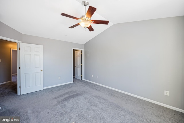 unfurnished bedroom featuring ceiling fan, carpet floors, and vaulted ceiling