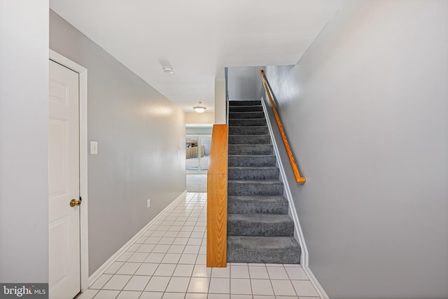 stairway featuring tile patterned floors