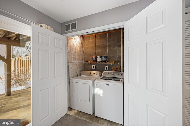 laundry room with separate washer and dryer