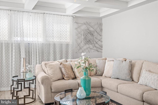 living room featuring beam ceiling, hardwood / wood-style flooring, coffered ceiling, and ornamental molding