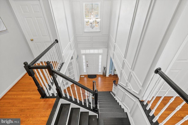 stairs with hardwood / wood-style flooring