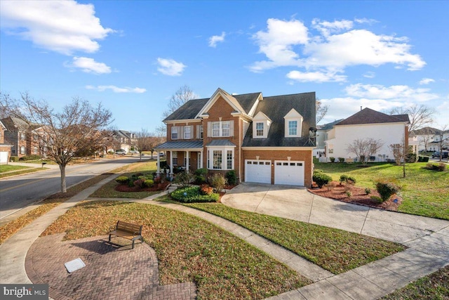 view of front of house featuring a garage and a front yard