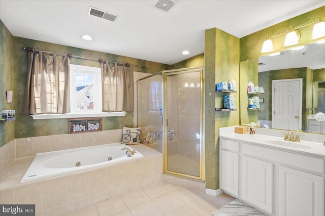 bathroom with tile patterned floors, separate shower and tub, and vanity