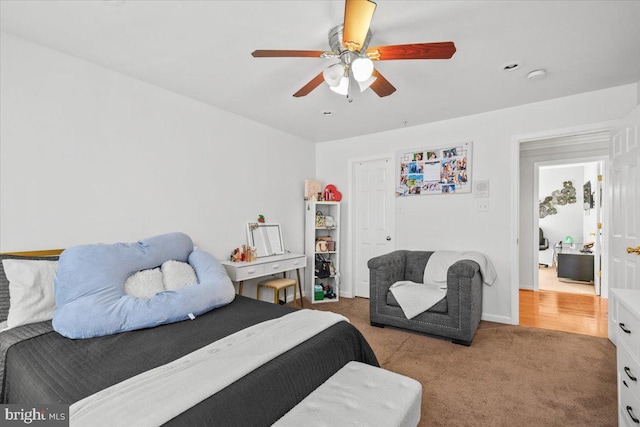 carpeted bedroom featuring ceiling fan