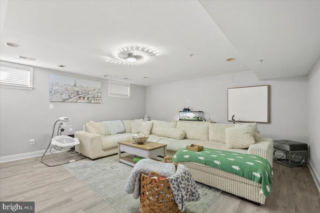 living room with light hardwood / wood-style floors