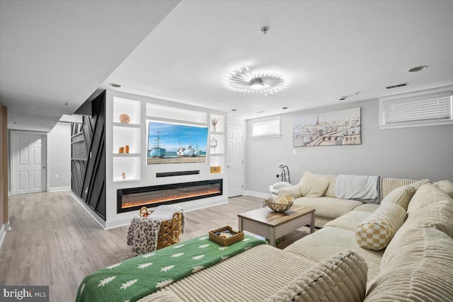 living room with light hardwood / wood-style floors