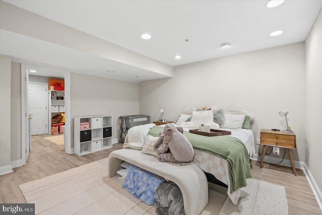 bedroom with light hardwood / wood-style floors