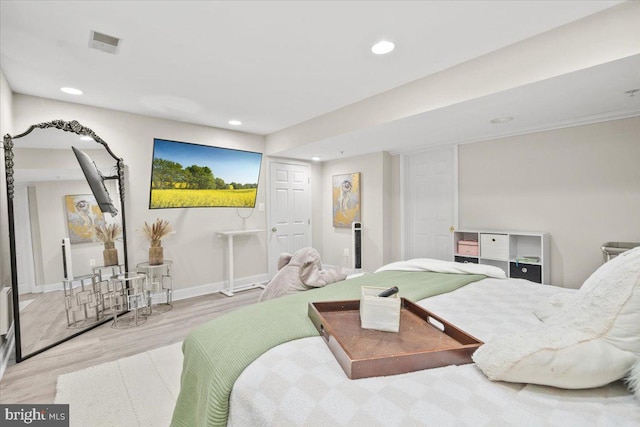 bedroom with light wood-type flooring