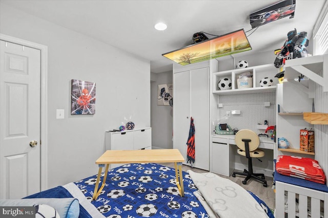 bedroom with light hardwood / wood-style flooring