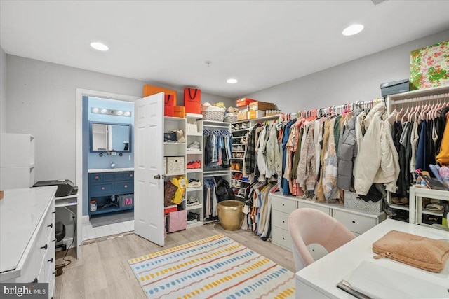 walk in closet featuring light wood-type flooring