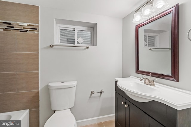 bathroom featuring tile patterned floors, vanity, and toilet