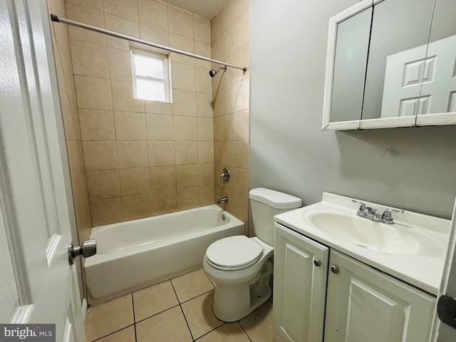 full bathroom featuring tile patterned flooring, vanity, tiled shower / bath combo, and toilet