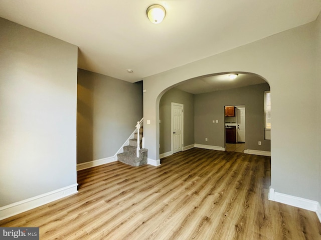 empty room with light hardwood / wood-style flooring