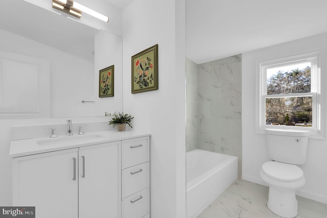 full bathroom with vanity, toilet, and tiled shower / bath