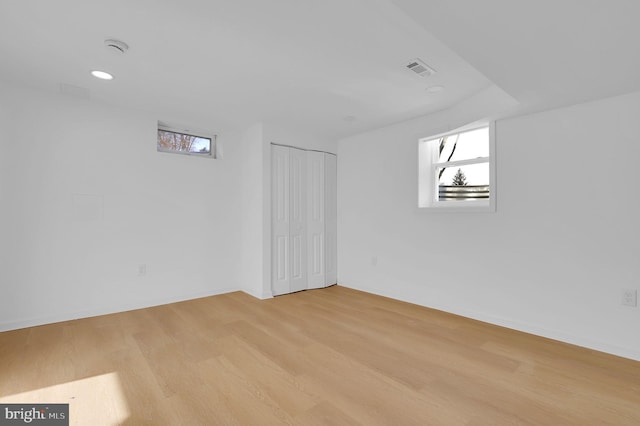 basement featuring light hardwood / wood-style floors