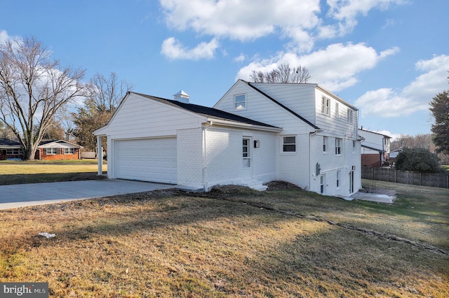 view of home's exterior with a yard and a garage