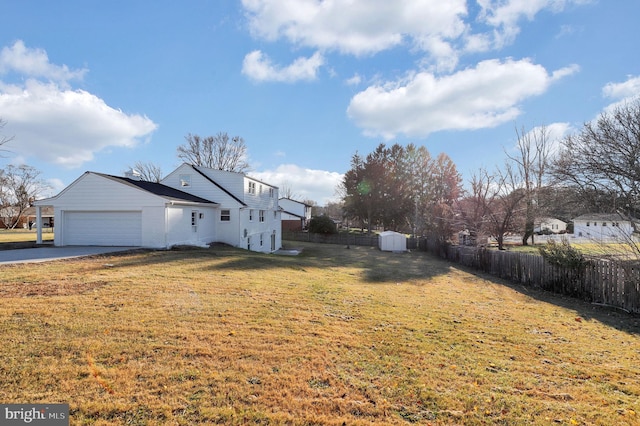 exterior space with a yard and a garage