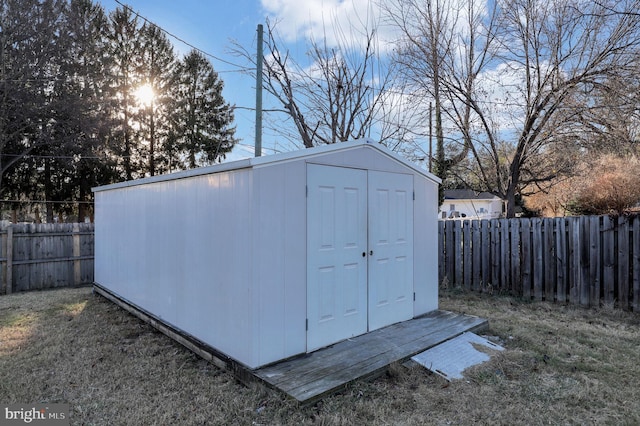 view of outbuilding with a lawn