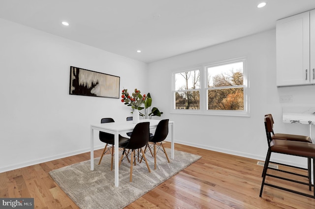 dining space featuring light hardwood / wood-style floors