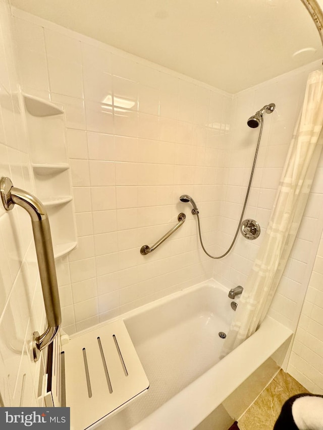 bathroom featuring shower / bath combo with shower curtain