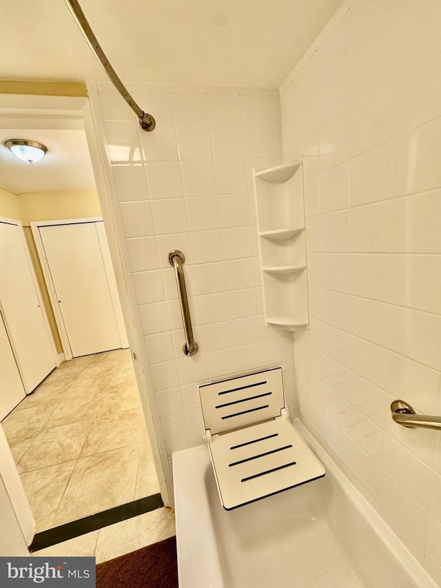 bathroom with tiled shower