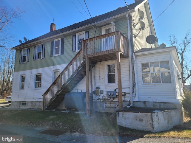 view of front of home with a balcony