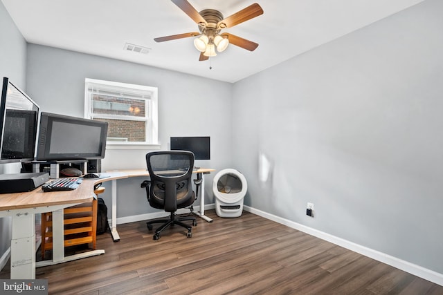 office space with ceiling fan and dark hardwood / wood-style flooring