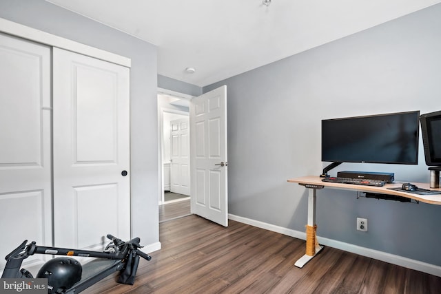 workout area featuring dark hardwood / wood-style floors