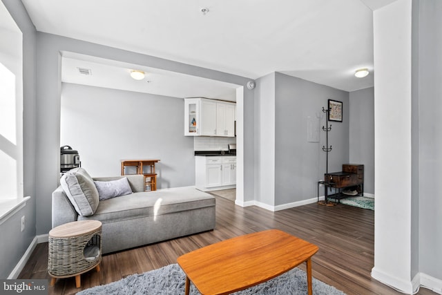 living room featuring dark hardwood / wood-style floors