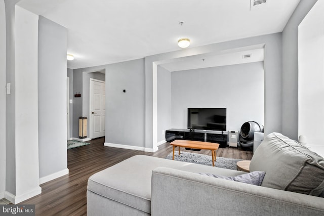 living room featuring dark wood-type flooring