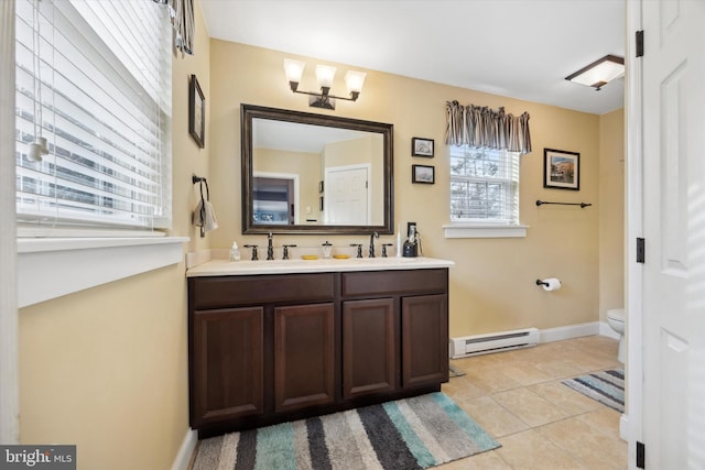 bathroom featuring an inviting chandelier, baseboard heating, tile patterned flooring, toilet, and vanity