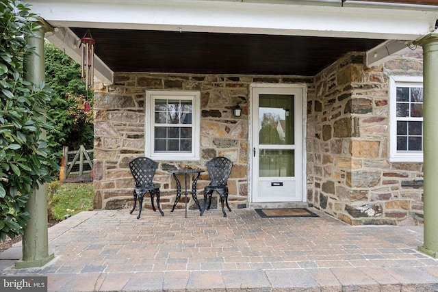 property entrance featuring a patio