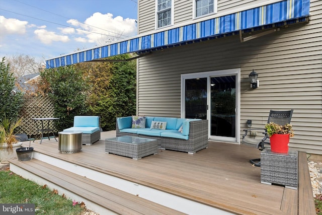 wooden deck featuring an outdoor hangout area