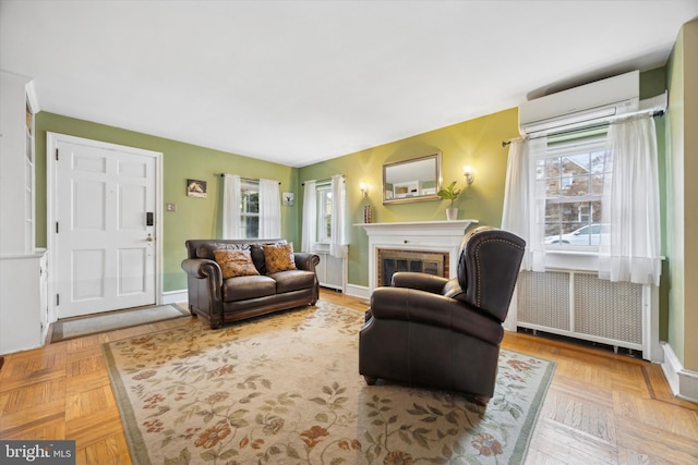 living room featuring an AC wall unit, radiator, and parquet floors