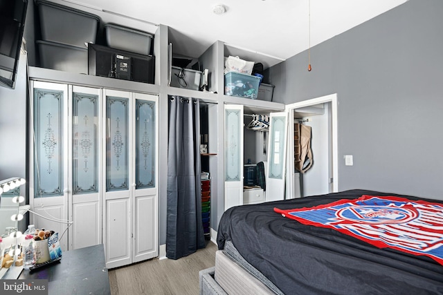 bedroom with hardwood / wood-style flooring